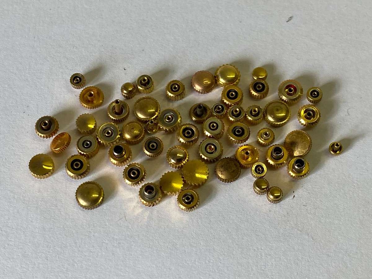 Assorted gold watch crowns - 50+ pieces
