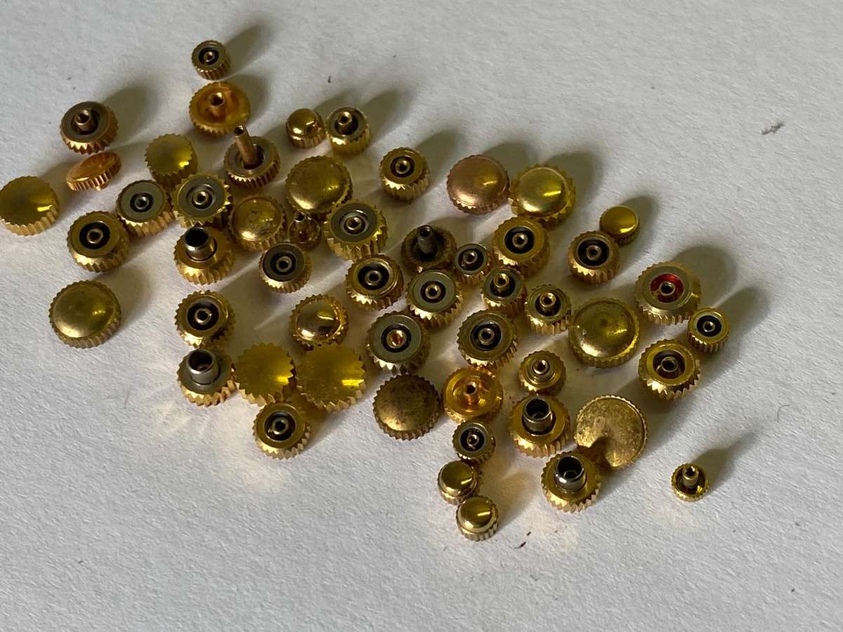 Assorted gold watch crowns - 50+ pieces
