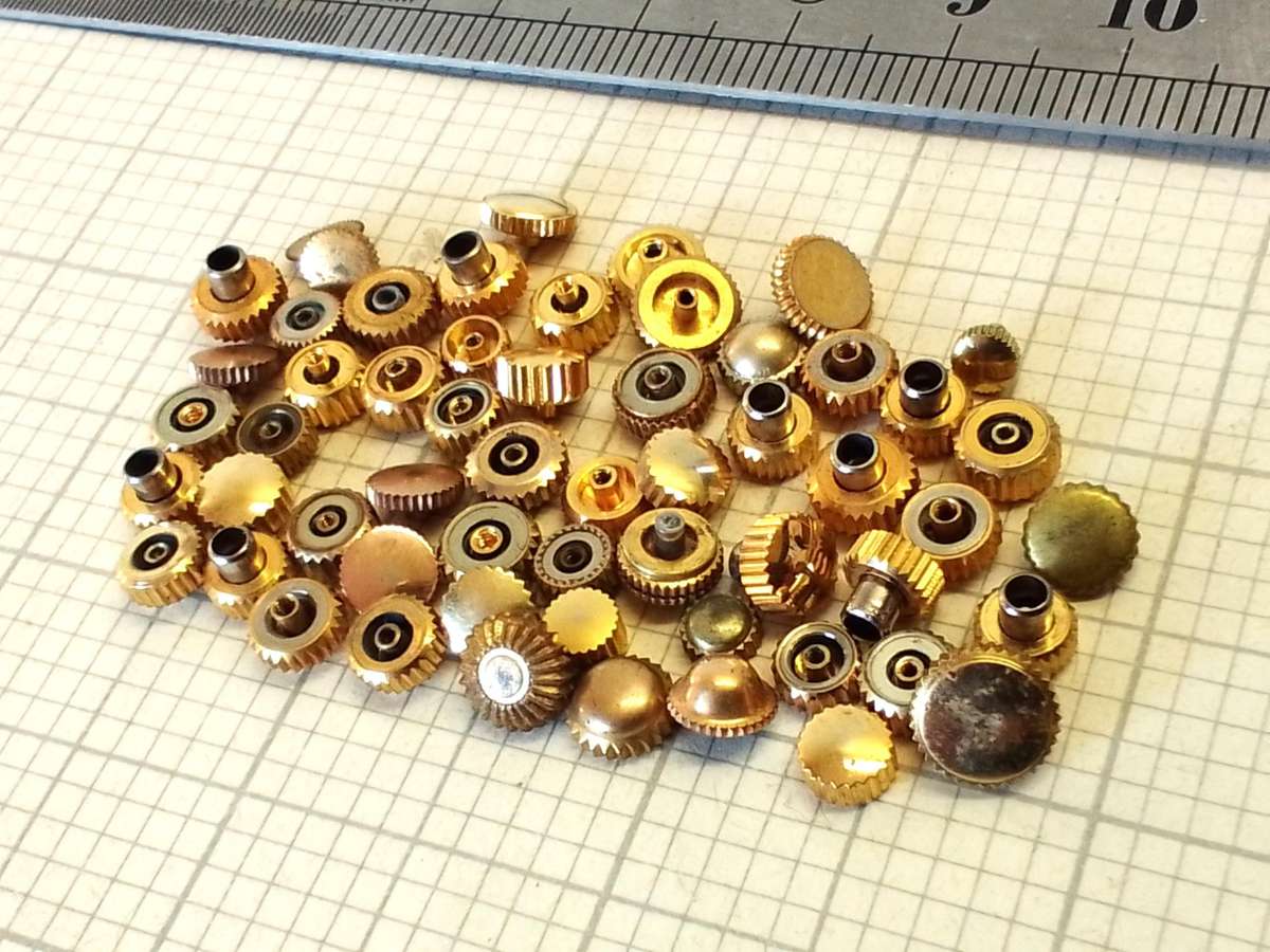Assorted gold watch crowns - 50+ pieces