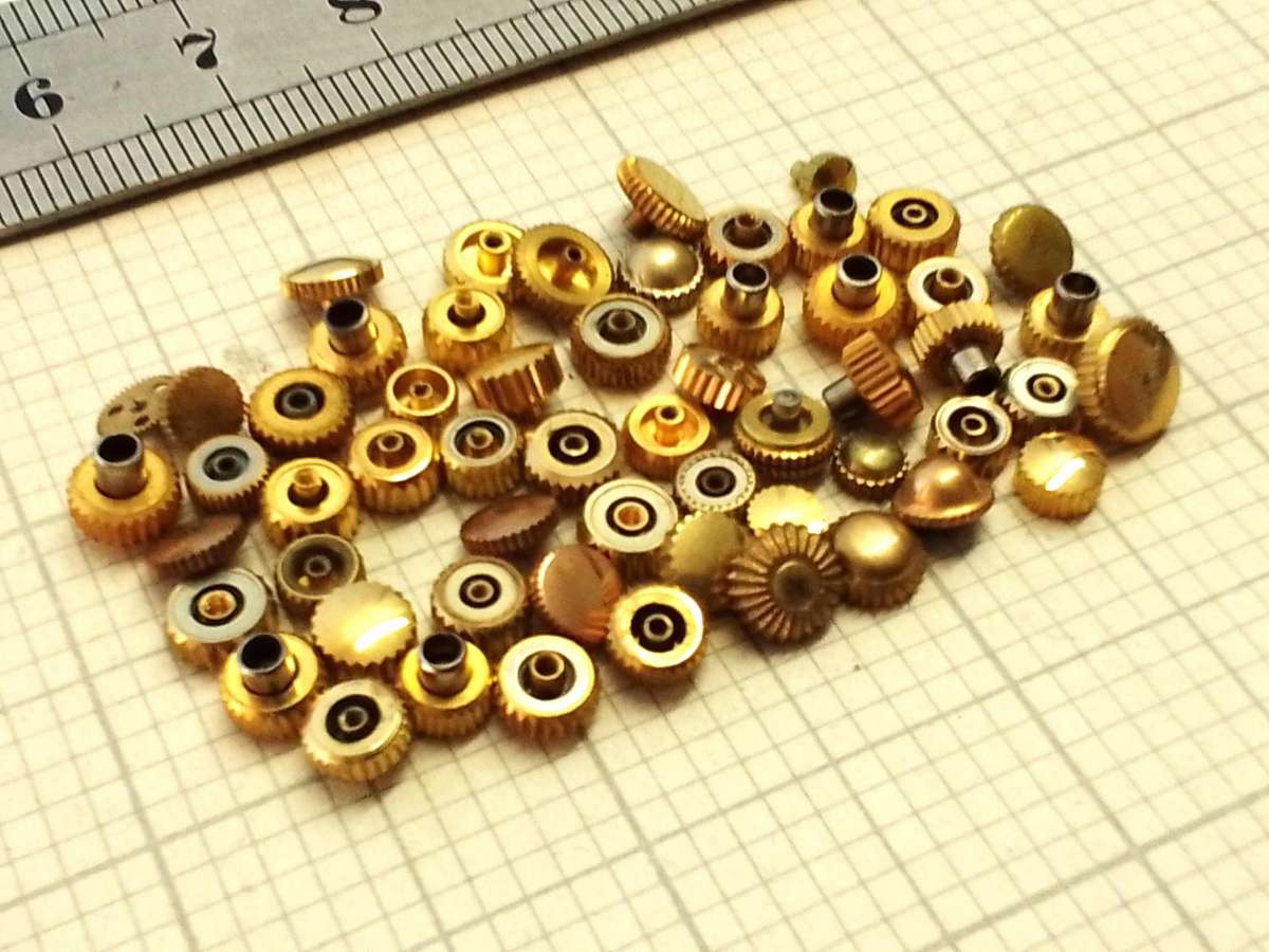 Assorted gold watch crowns - 50+ pieces
