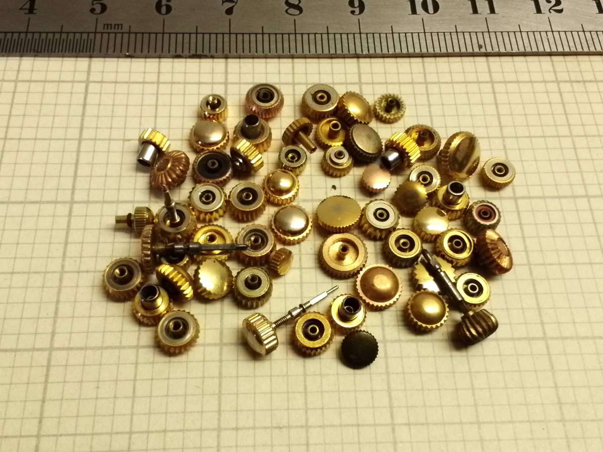 Assorted gold watch crowns - 50+ pieces