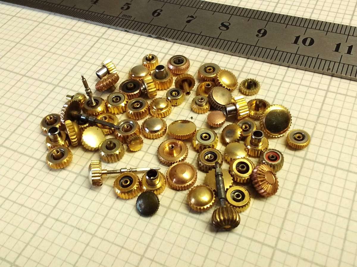 Assorted gold watch crowns - 50+ pieces
