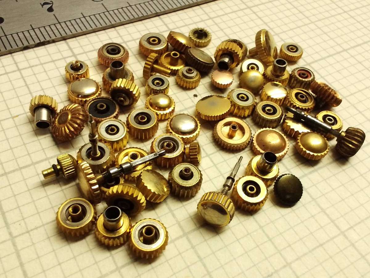 Assorted gold watch crowns - 50+ pieces