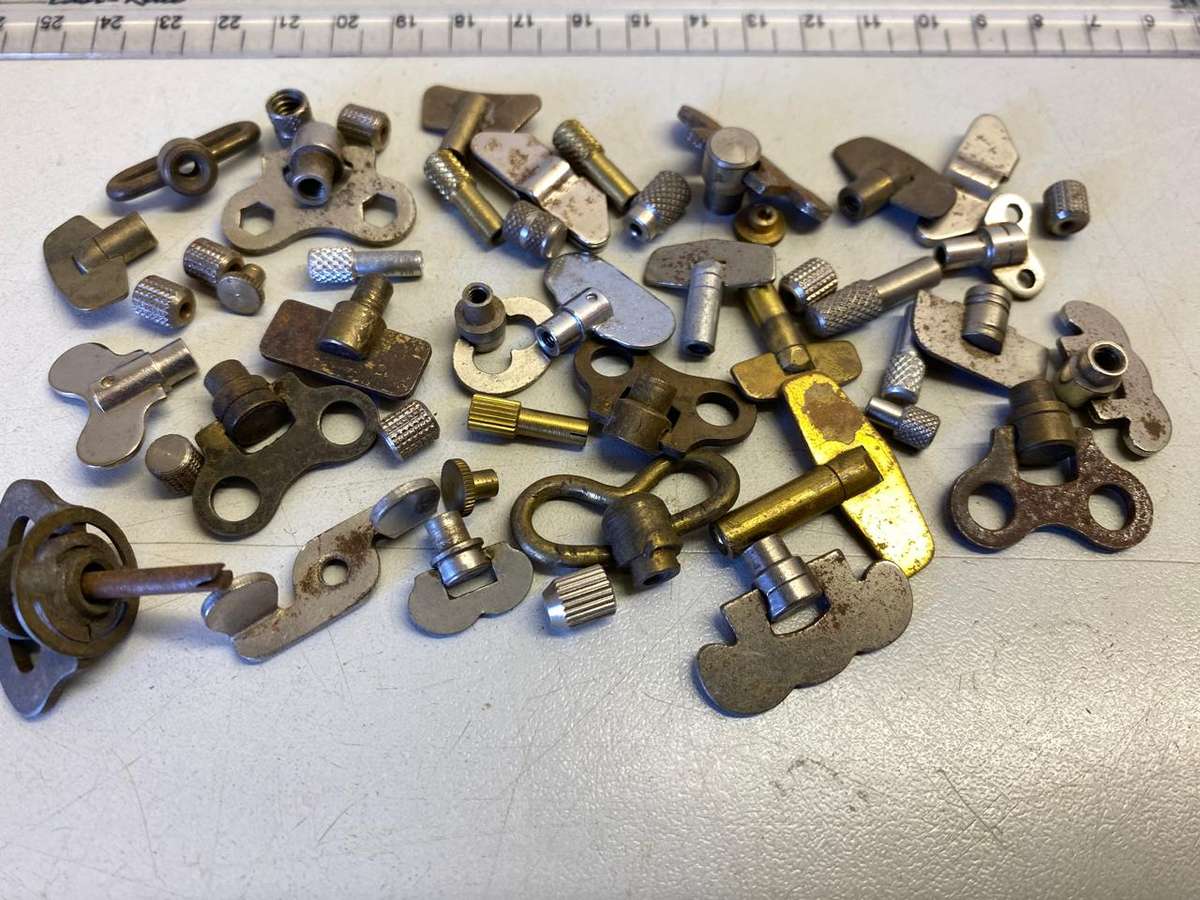 Alarm clock winders & time setters