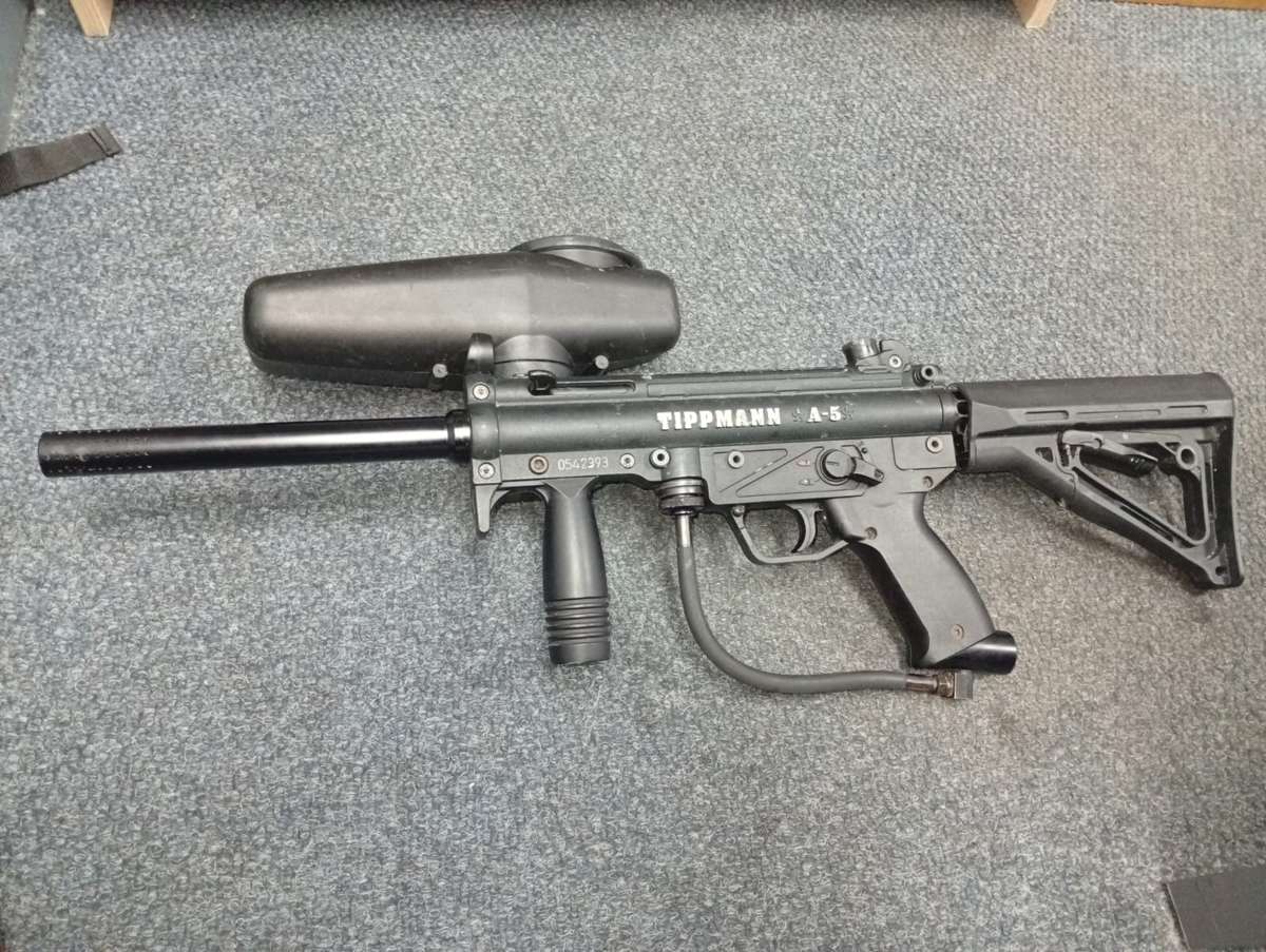 Tippmann a5 paintball marker with response trigger