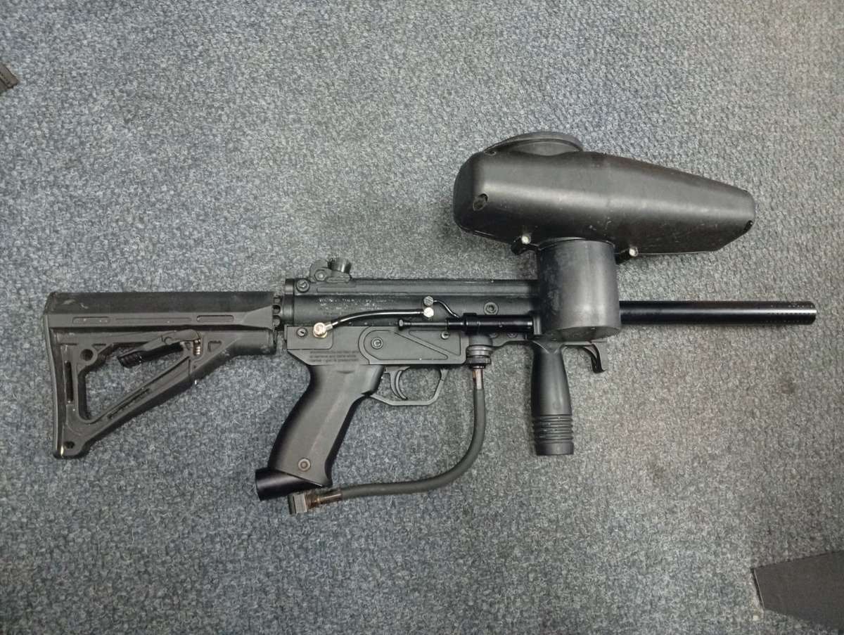 Tippmann a5 paintball marker with response trigger