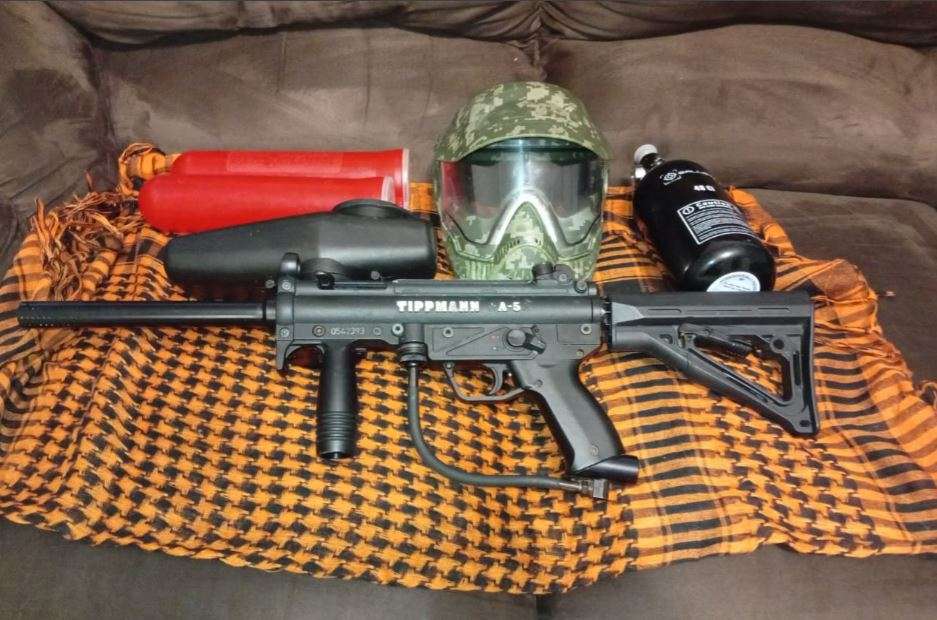 Tippmann a5 paintball marker with response trigger
