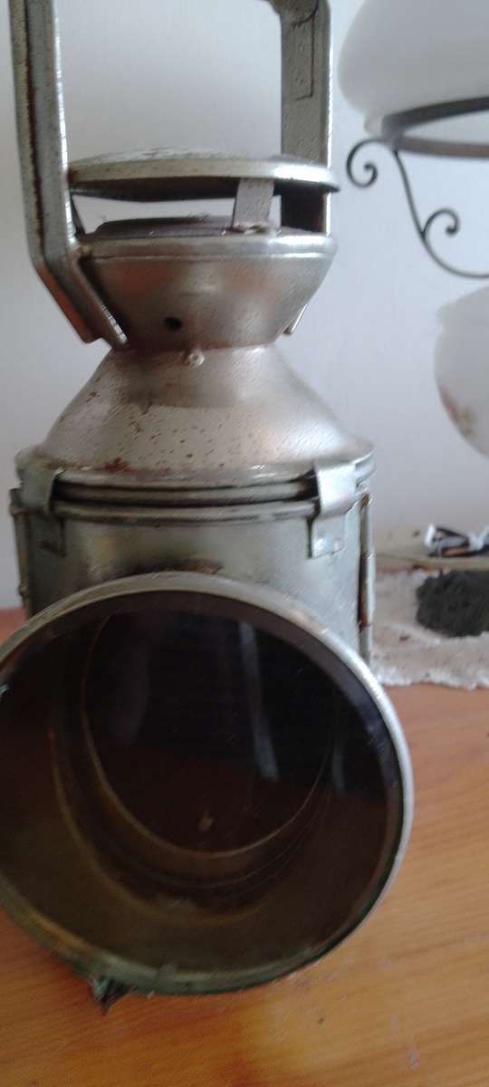An antique shunters lamp electrified