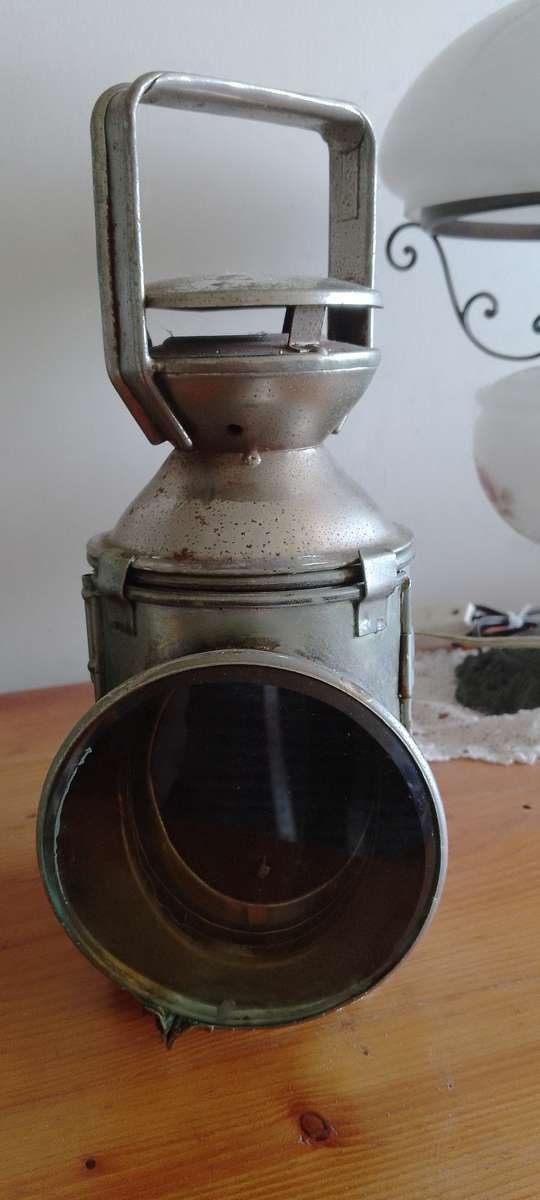 An antique shunters lamp electrified