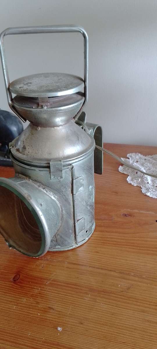An antique shunters lamp electrified