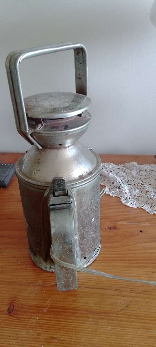 An antique shunters lamp electrified