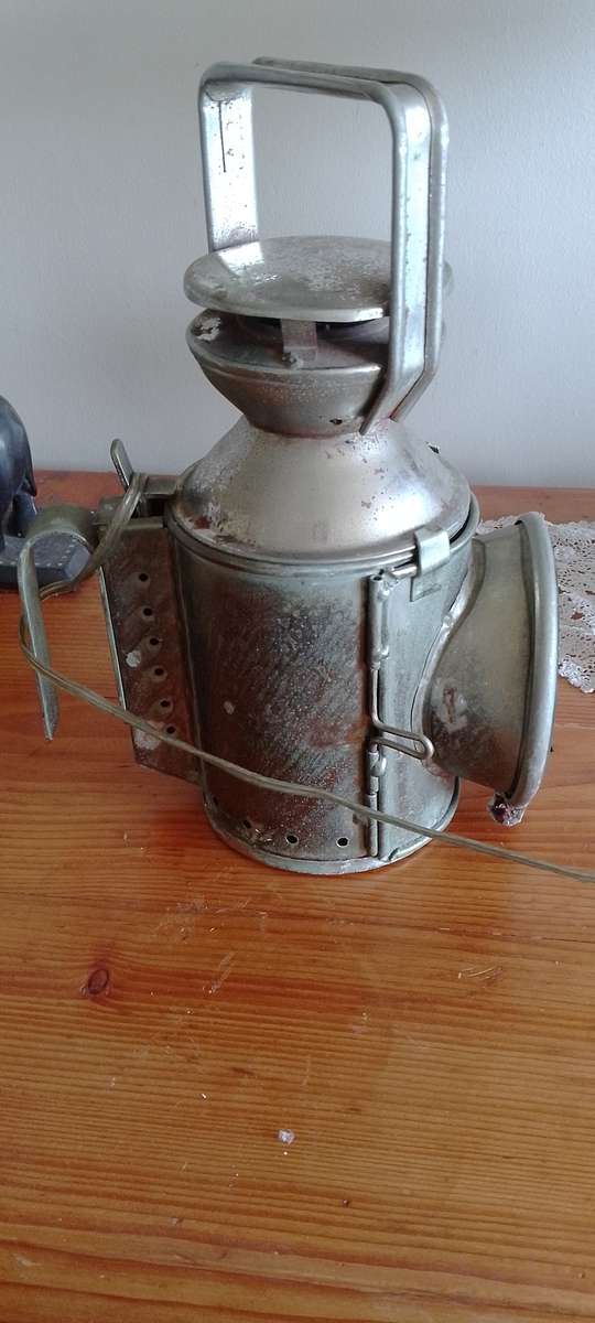 An antique shunters lamp electrified