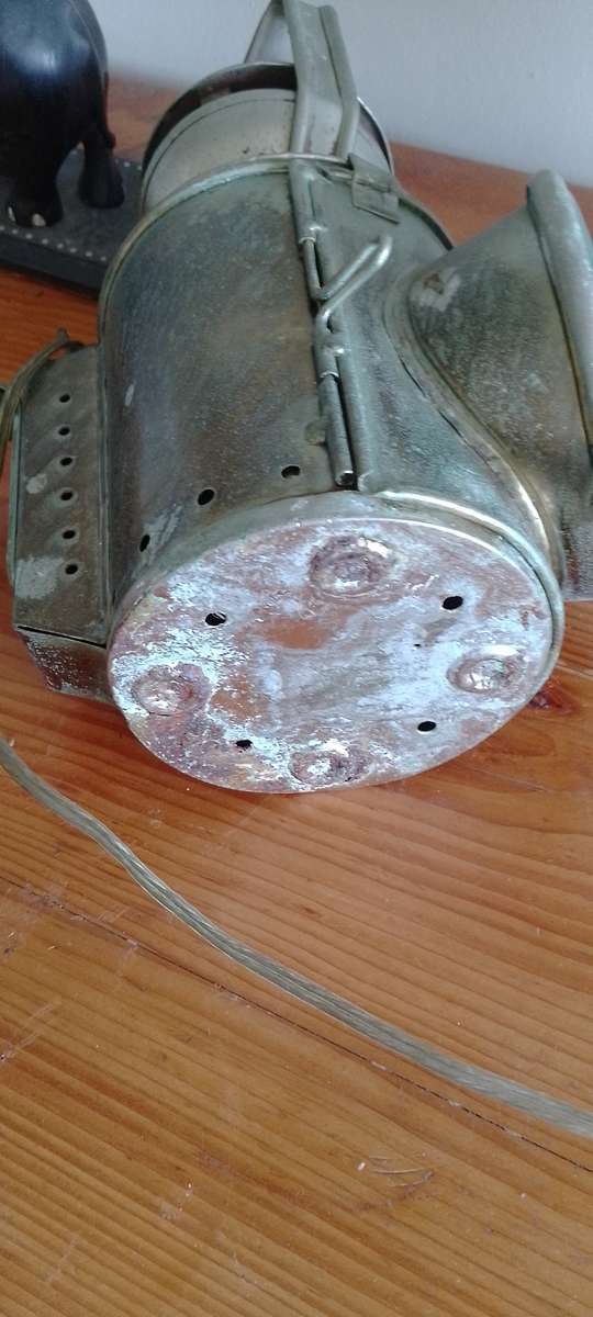 An antique shunters lamp electrified