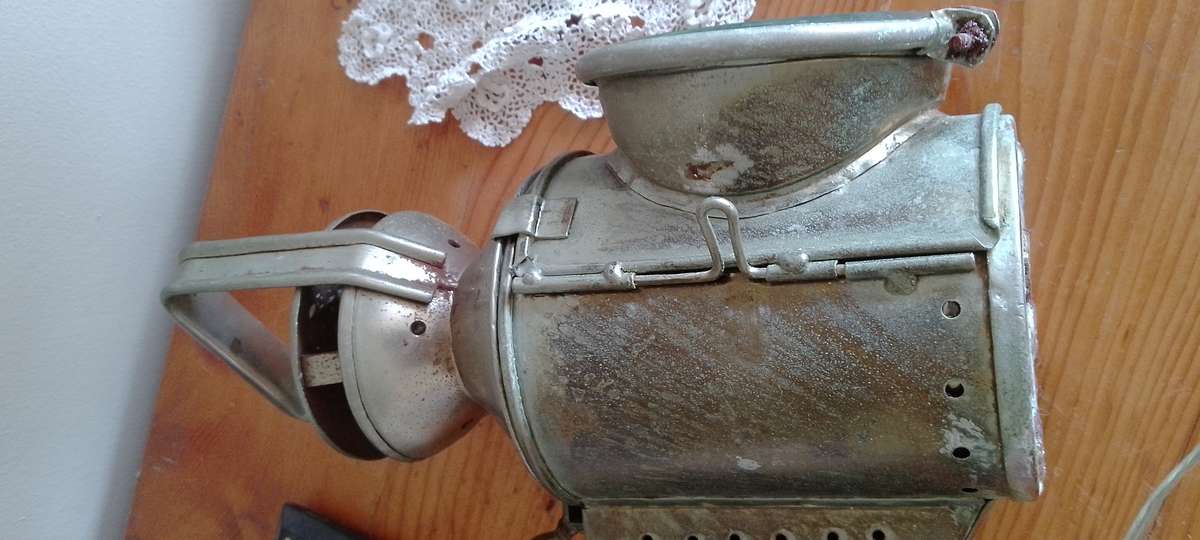 An antique shunters lamp electrified