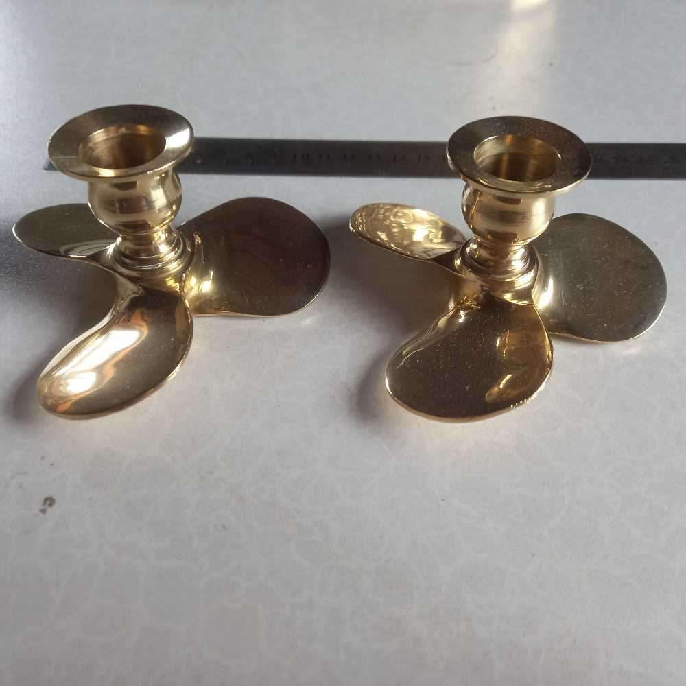 Quality Pair of solid brass propeller candlesticks