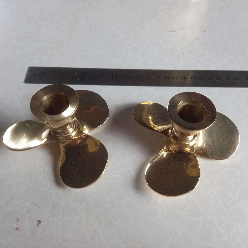Quality Pair of solid brass propeller candlesticks