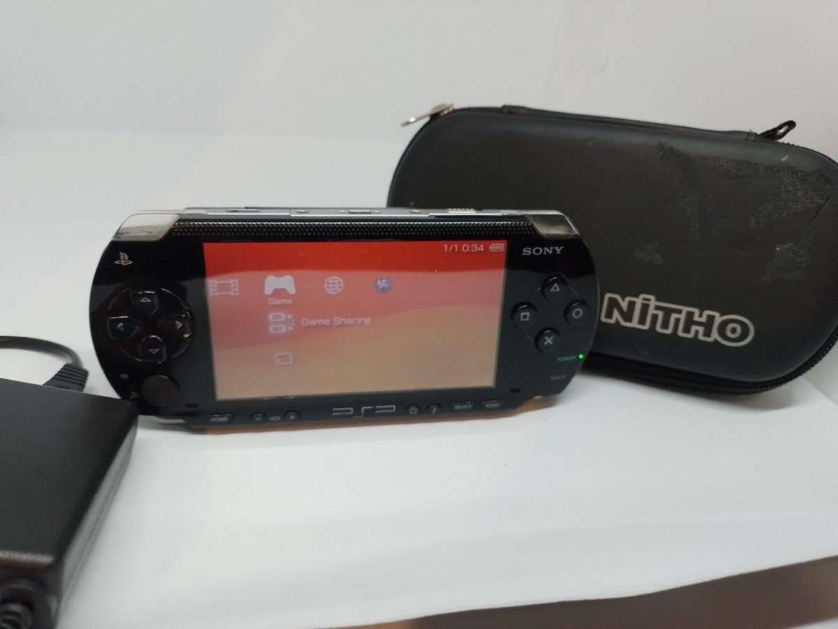 PSP 1000,  Charger, Carry Case, no memory Card