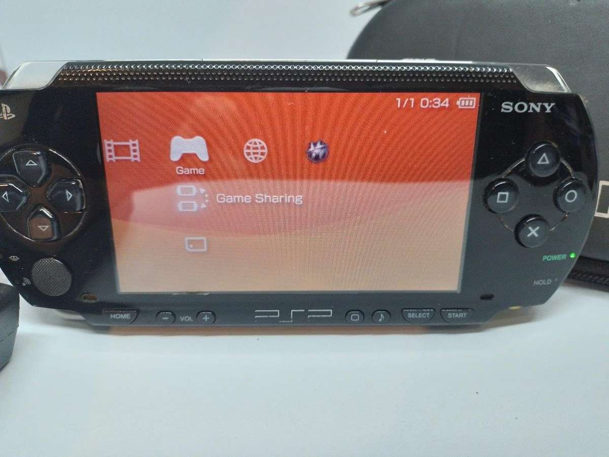 PSP 1000,  Charger, Carry Case, no memory Card