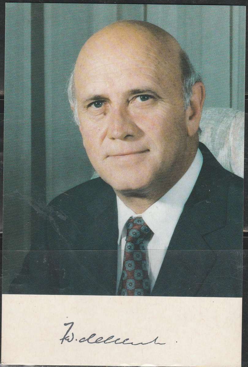 A PHOTO OF F.W. DEKLERK MWITH A SIGNATURE BOTTOM LOOK SCAN
