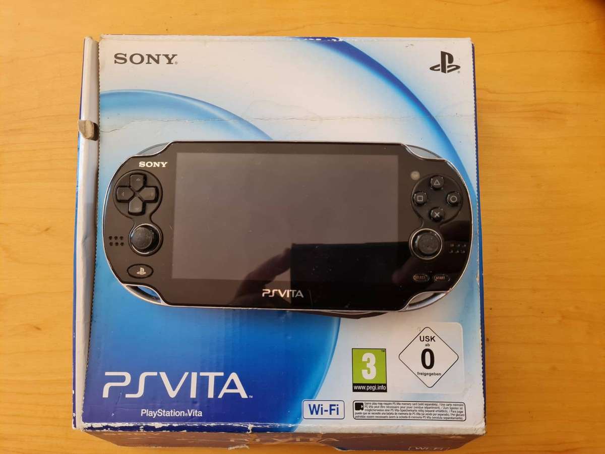 Sony PS Vita OLED (PCH-1004)  Boxed + 8GB Memory Card & Charger