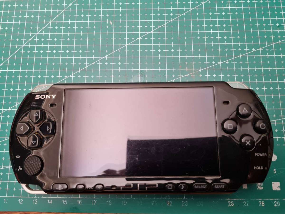 Sony PSP-3004 Bundle  Working + Charger, 2GB Memory Stick & Medal of Honor Game