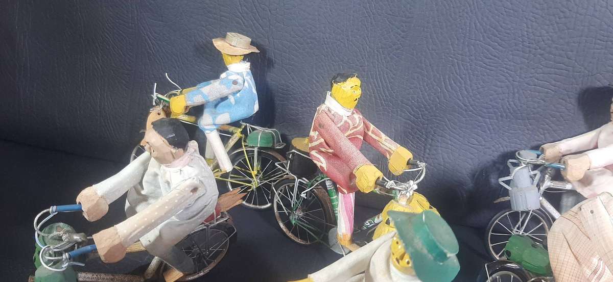 HANDMADE VINTAGE CYCLIST FIGURES  SET OF 8