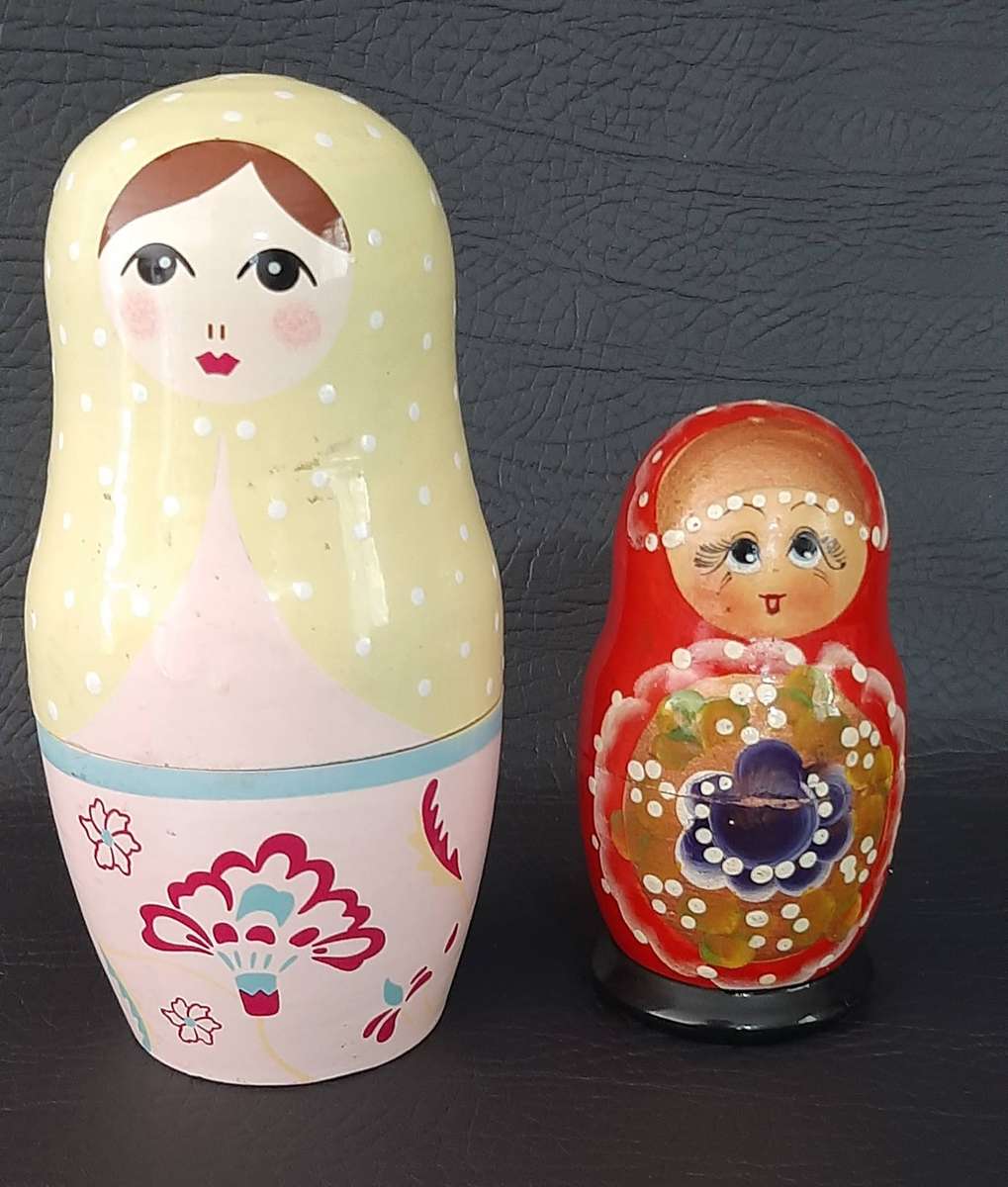 TWO VINTAGE BABUSHKA DOLL SETS  8 HAND-PAINTED NESTING TREASURES