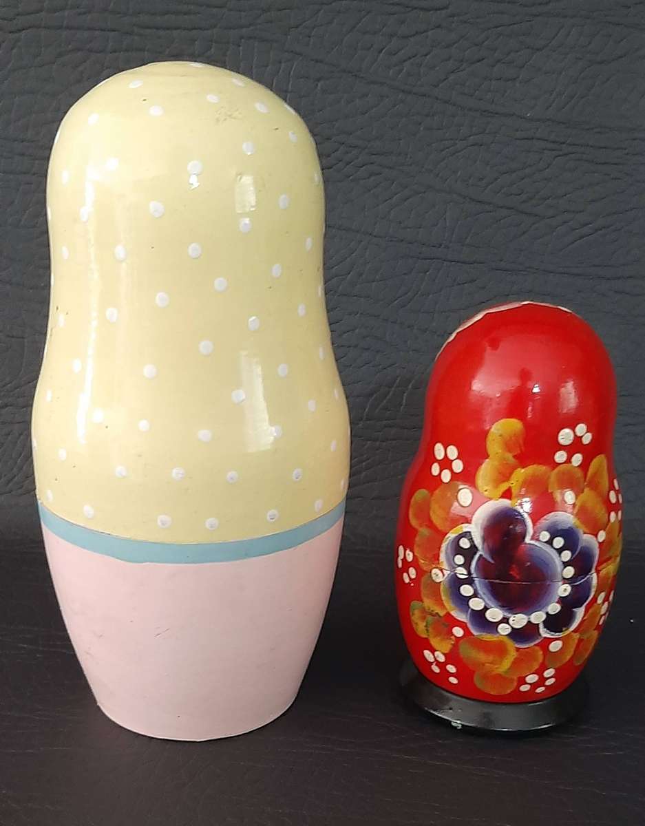 TWO VINTAGE BABUSHKA DOLL SETS  8 HAND-PAINTED NESTING TREASURES