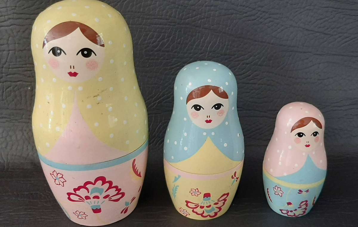 TWO VINTAGE BABUSHKA DOLL SETS  8 HAND-PAINTED NESTING TREASURES