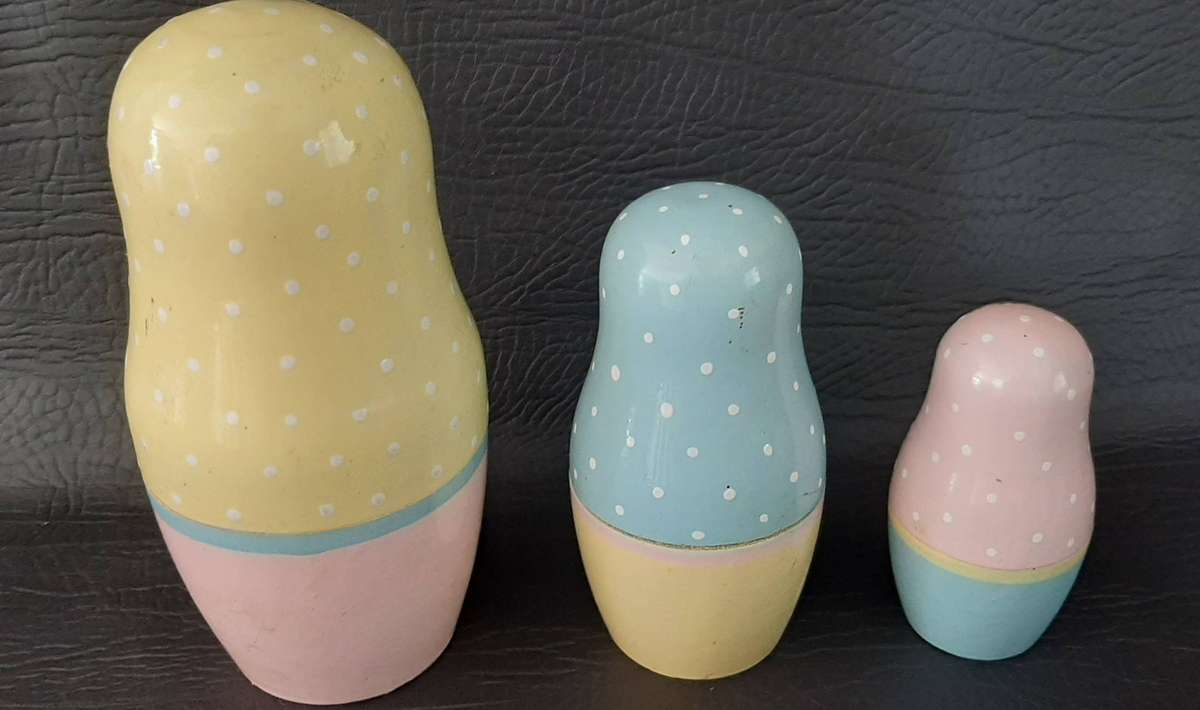 TWO VINTAGE BABUSHKA DOLL SETS  8 HAND-PAINTED NESTING TREASURES