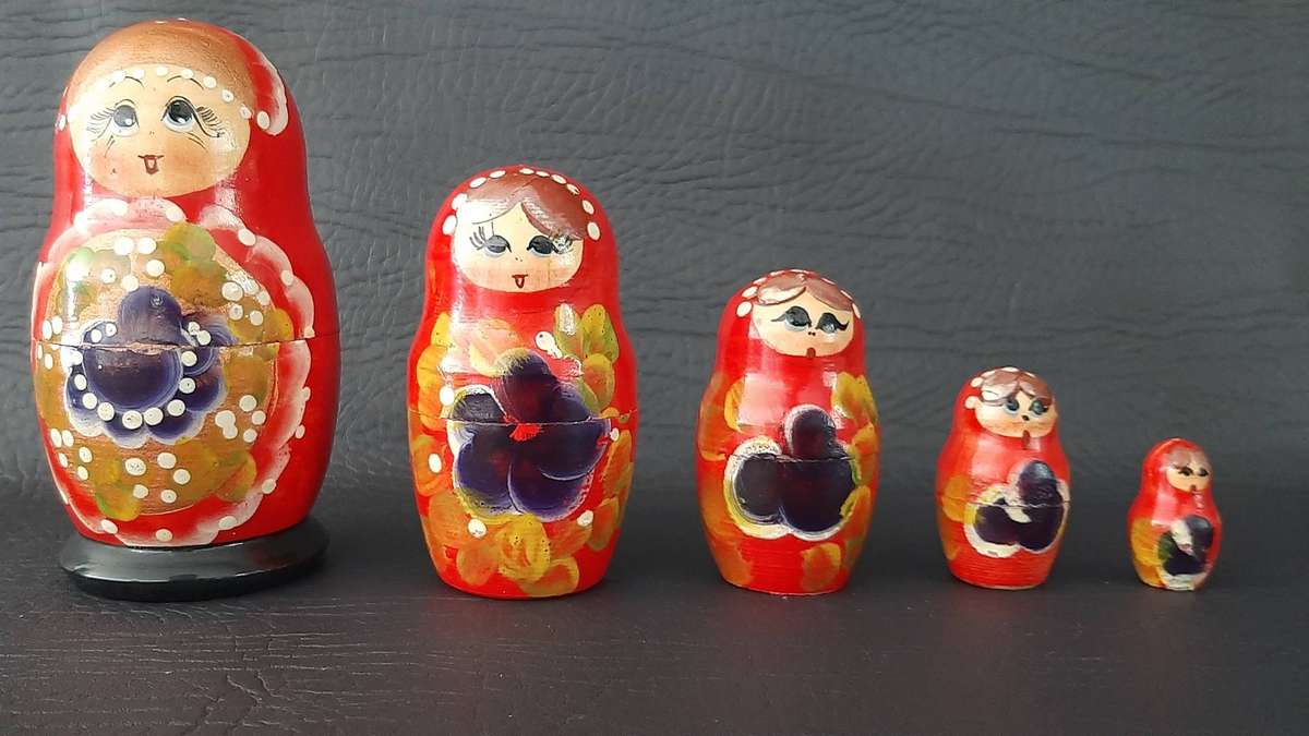 TWO VINTAGE BABUSHKA DOLL SETS  8 HAND-PAINTED NESTING TREASURES