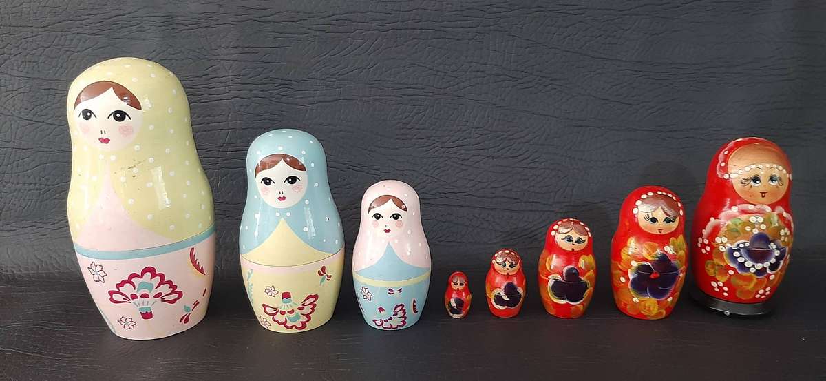 TWO VINTAGE BABUSHKA DOLL SETS  8 HAND-PAINTED NESTING TREASURES
