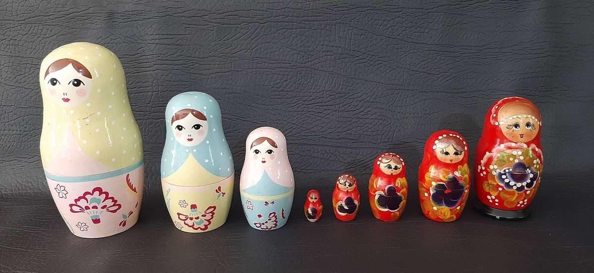 TWO VINTAGE BABUSHKA DOLL SETS  8 HAND-PAINTED NESTING TREASURES
