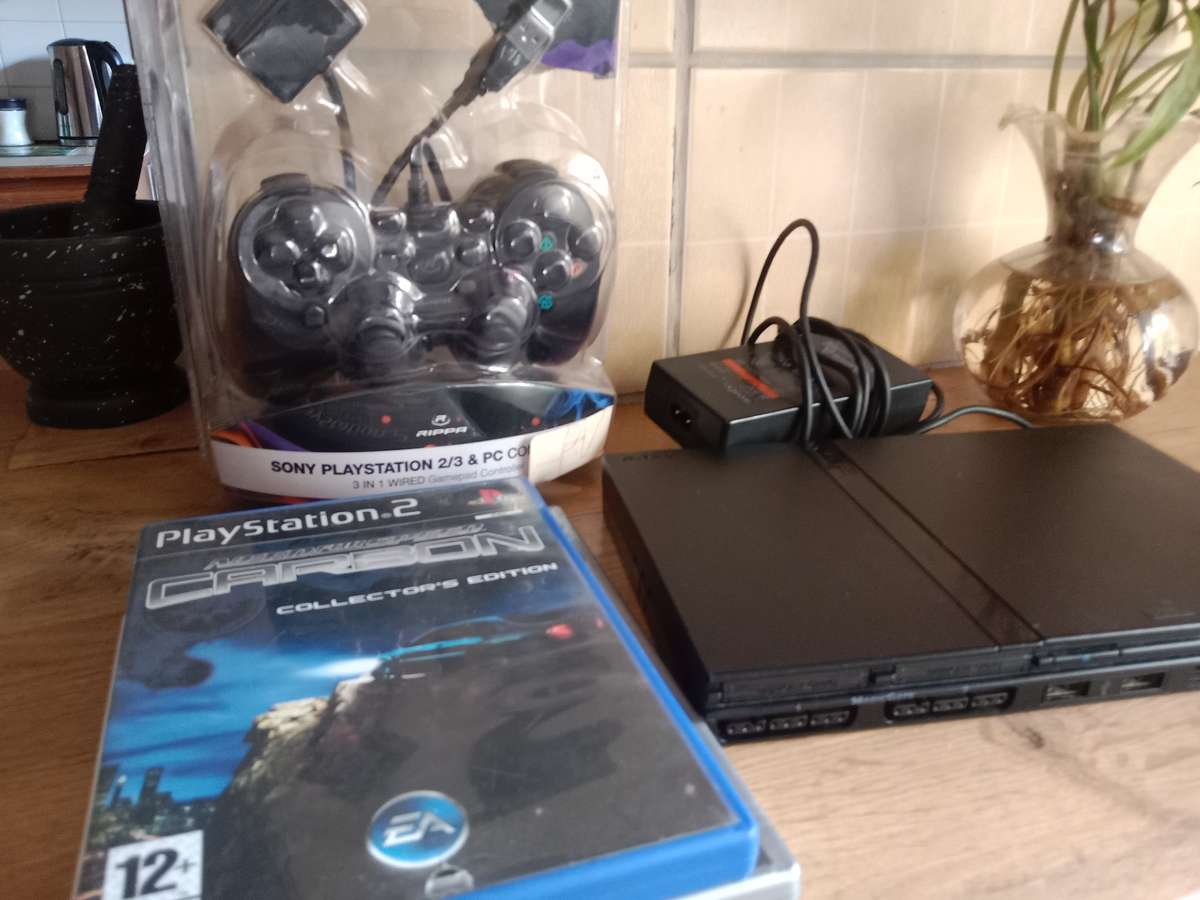 PS2 slim bundle . Needs repair