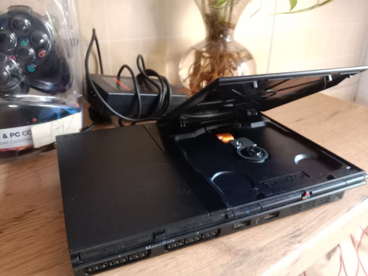 PS2 slim bundle . Needs repair