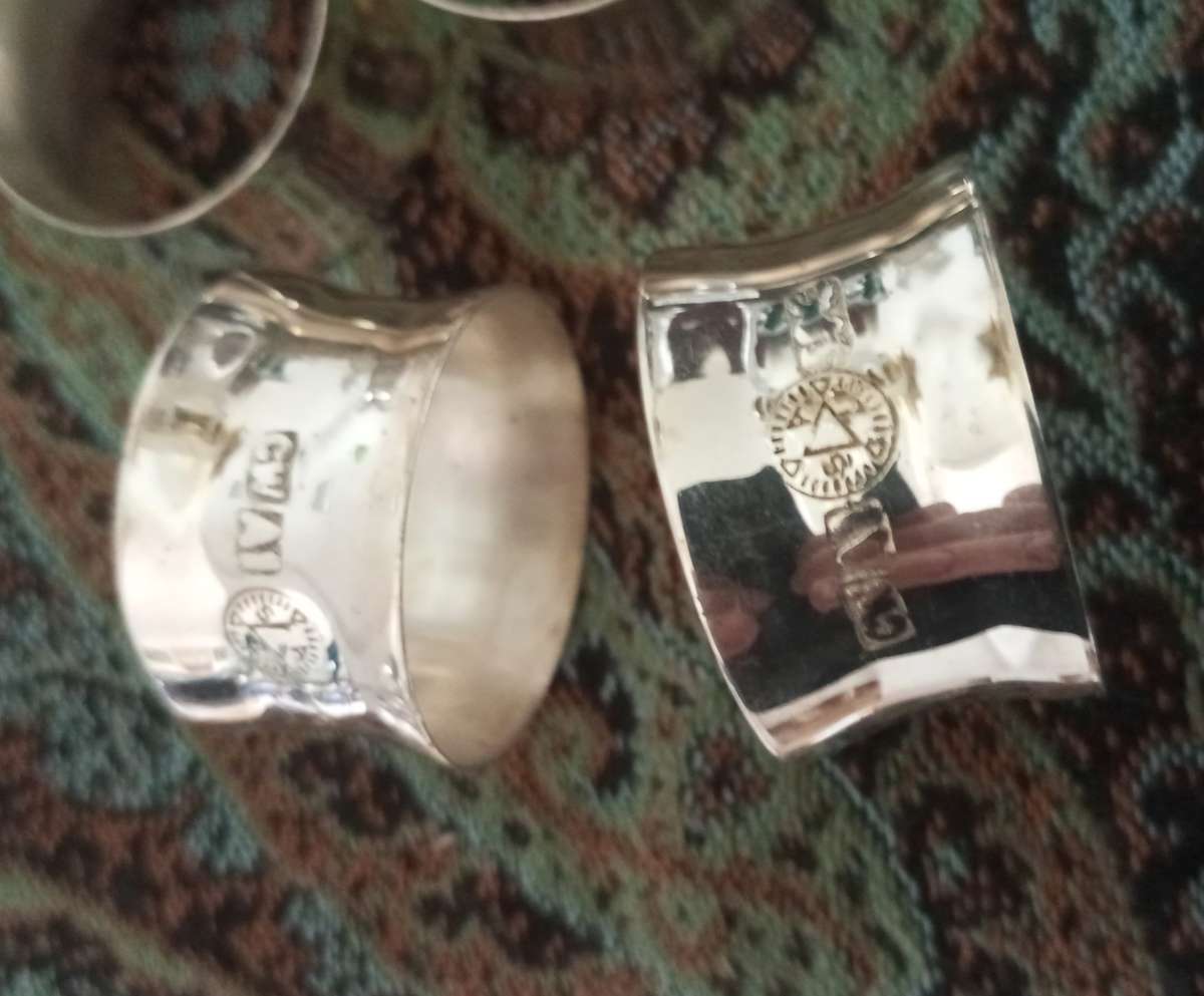 A set of fine silver plated napkin rings