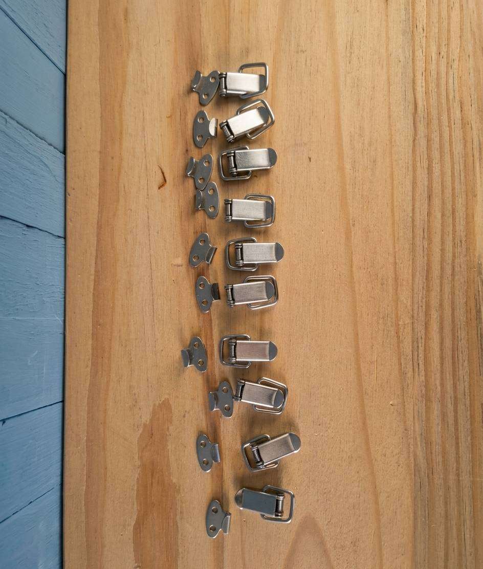 10 Small stainless steel toggle latches (unused)