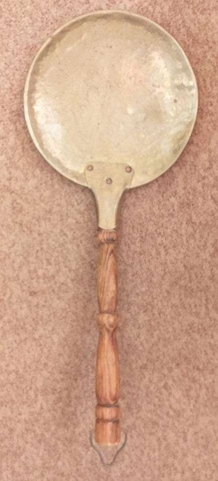 Large antique copper ladle with wooden handle