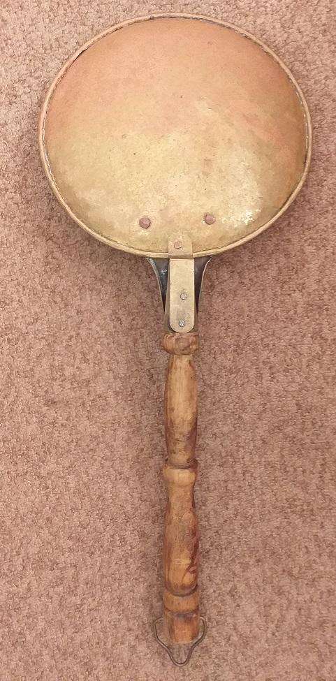 Large antique copper ladle with wooden handle