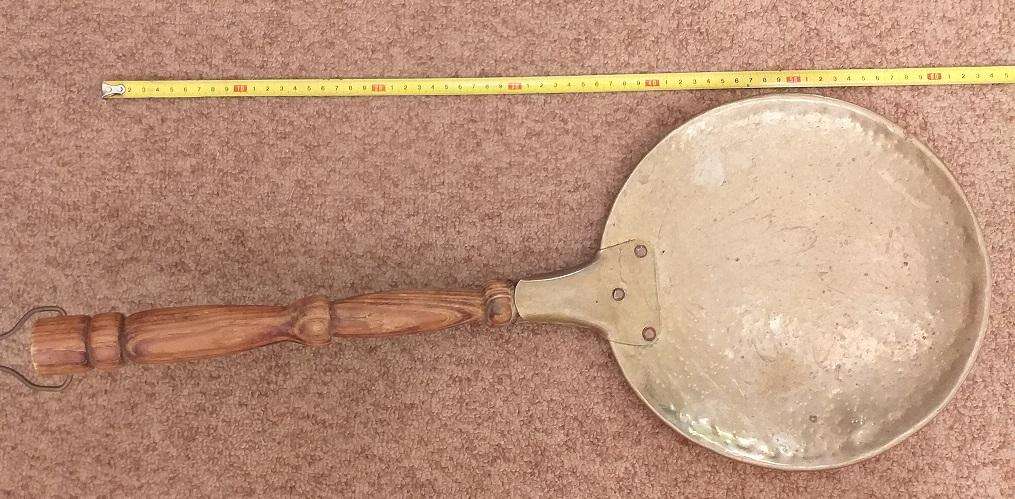 Large antique copper ladle with wooden handle
