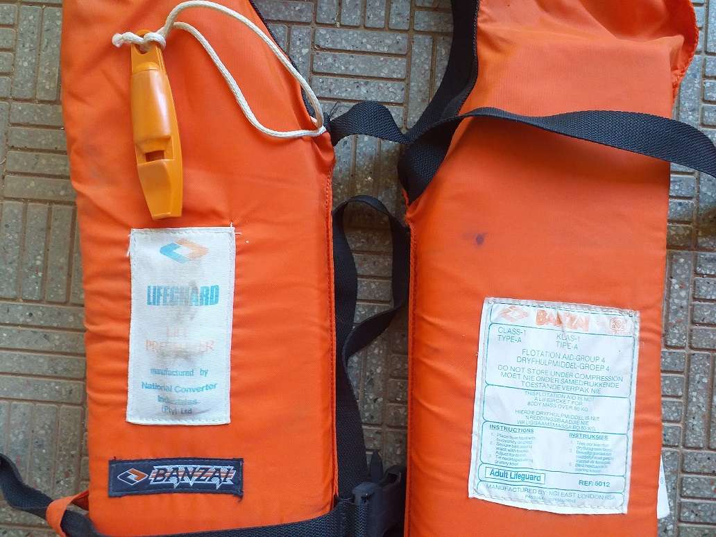 Two antique life jackets sold as a set