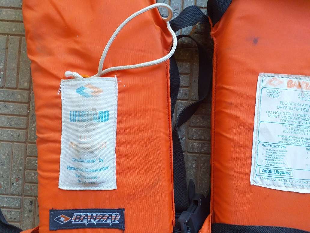 Two antique life jackets sold as a set