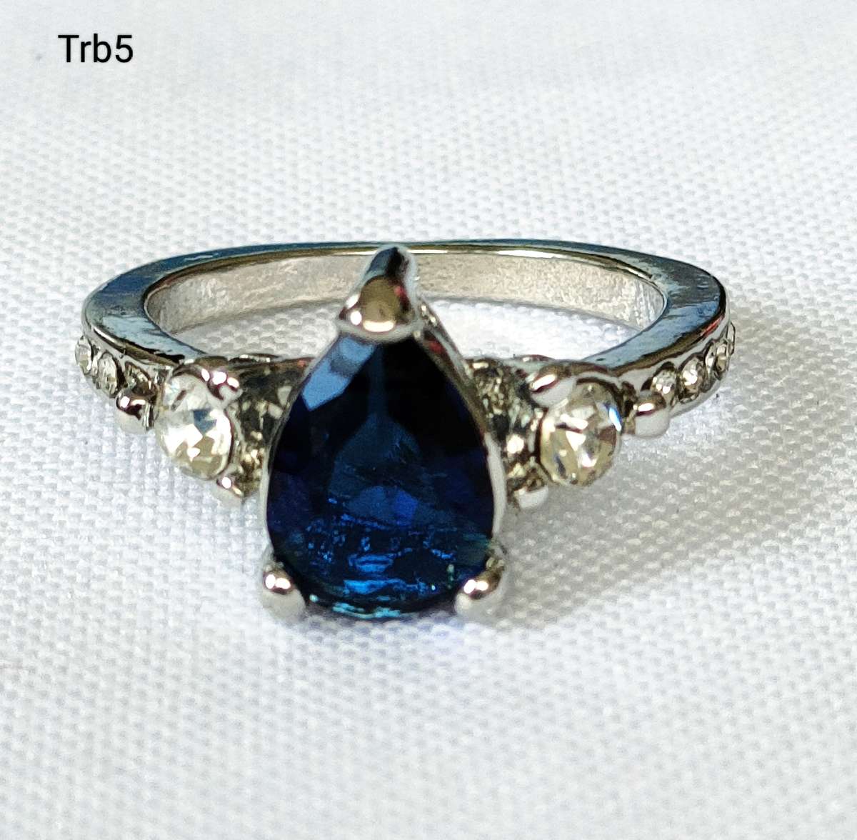 Dress ring -lab created oval blue and white stones- size US 7