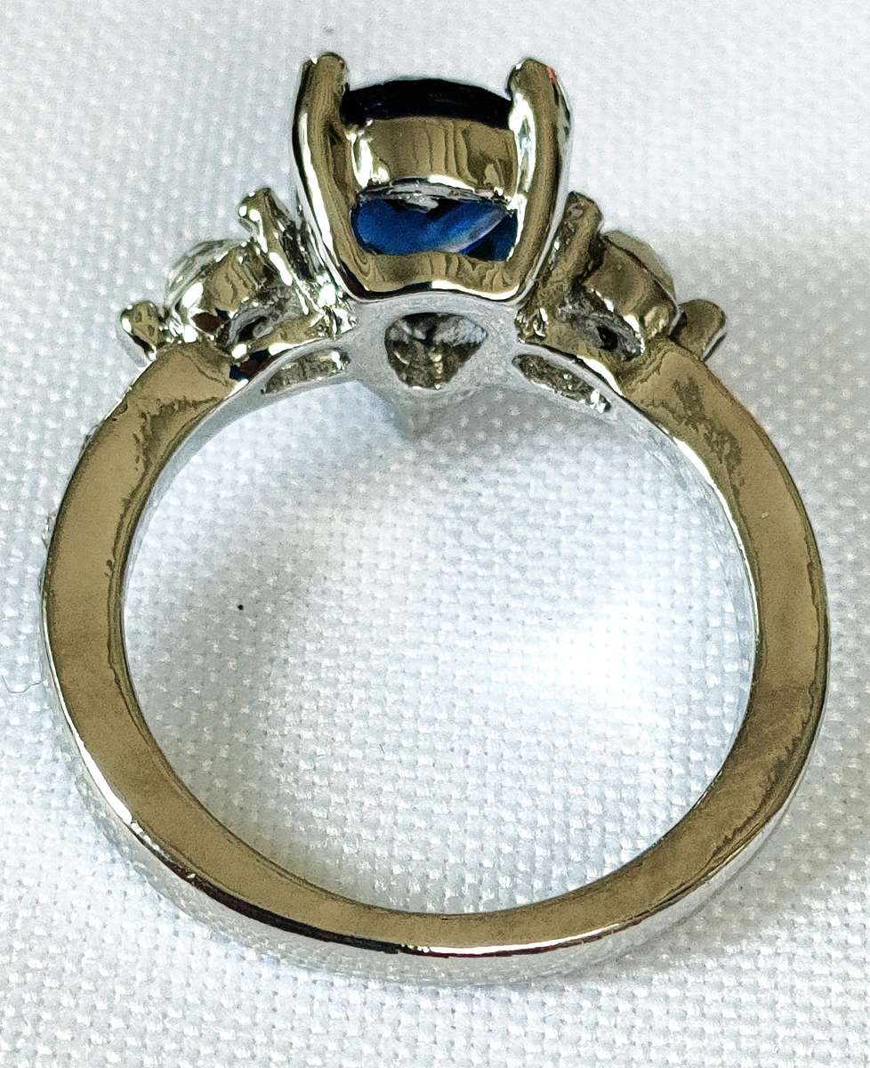 Dress ring -lab created oval blue and white stones- size US 7