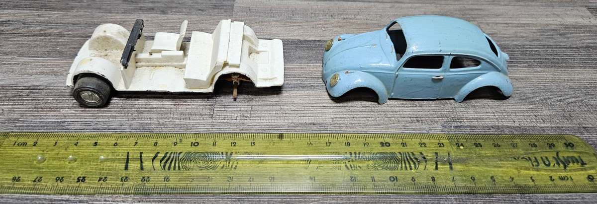 Vintage toy car parts as pictured