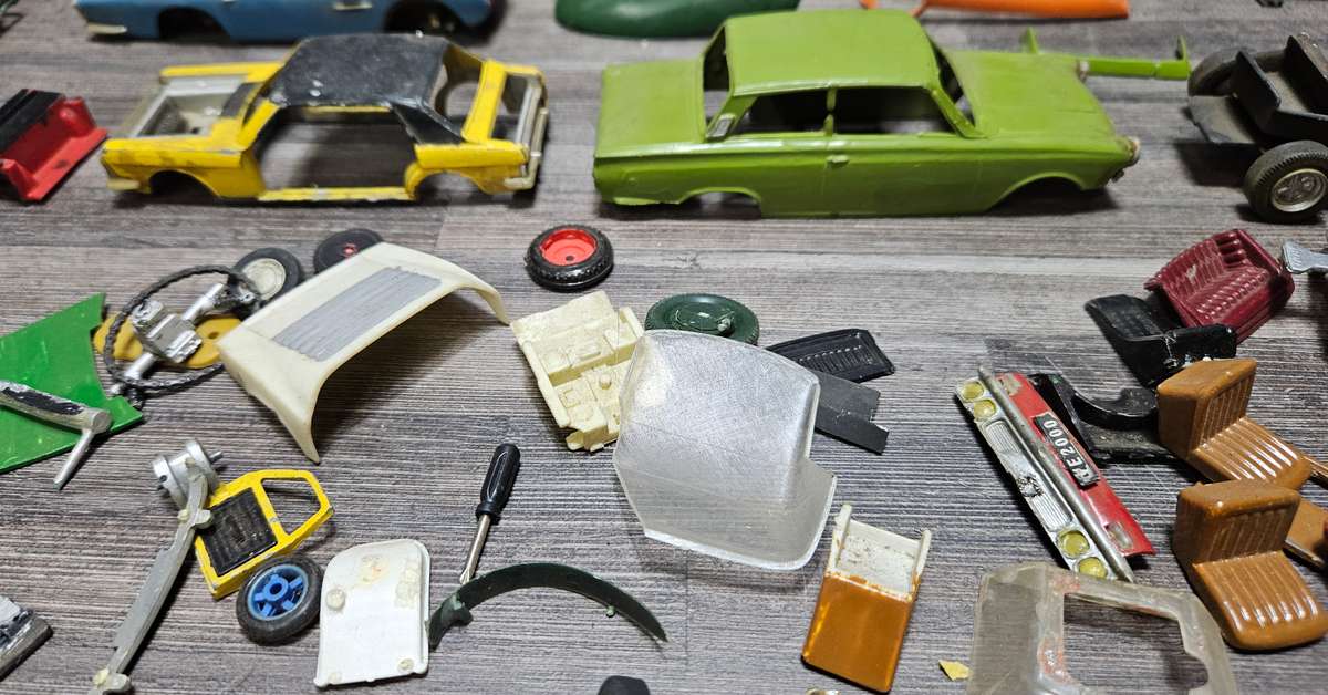 Vintage toy car parts as pictured