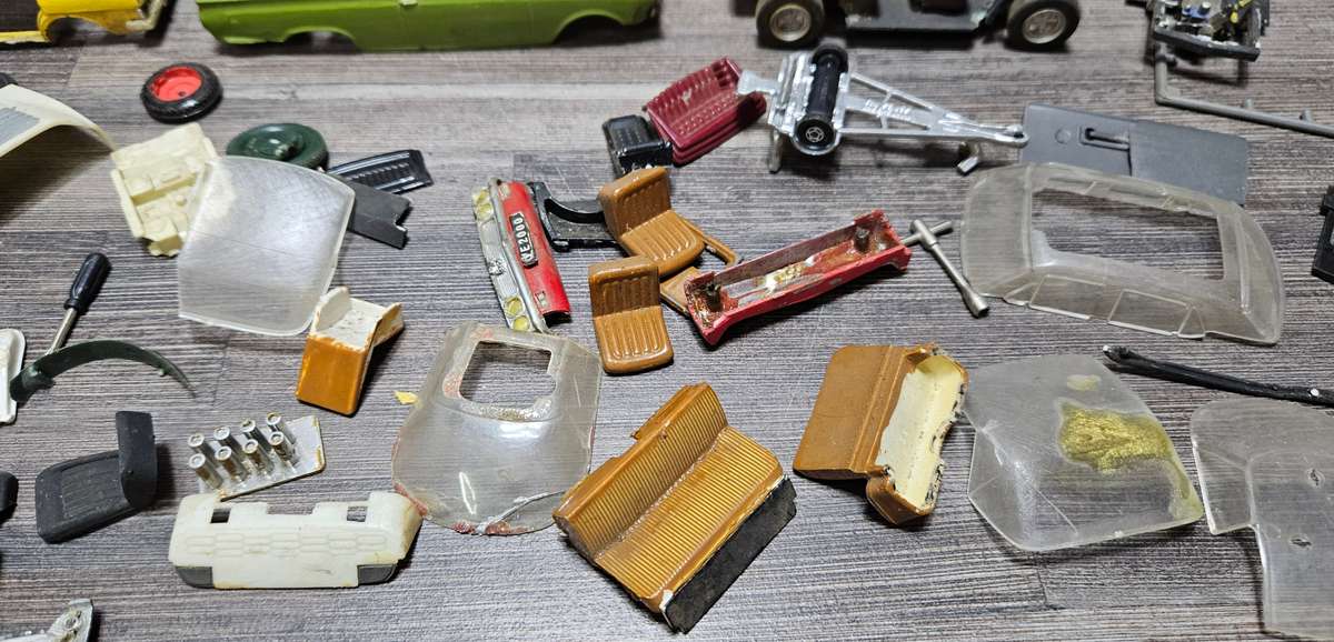 Vintage toy car parts as pictured