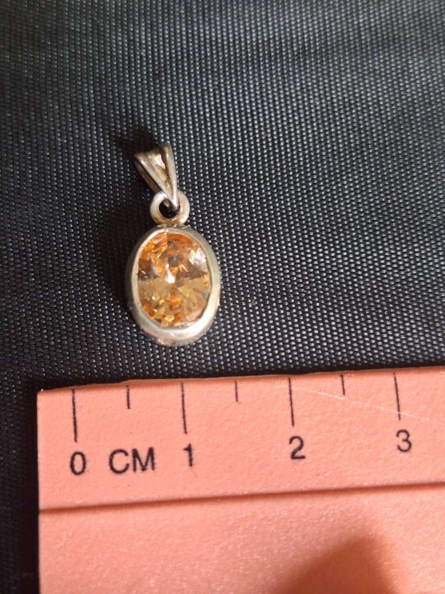 Silver pendant with stone in