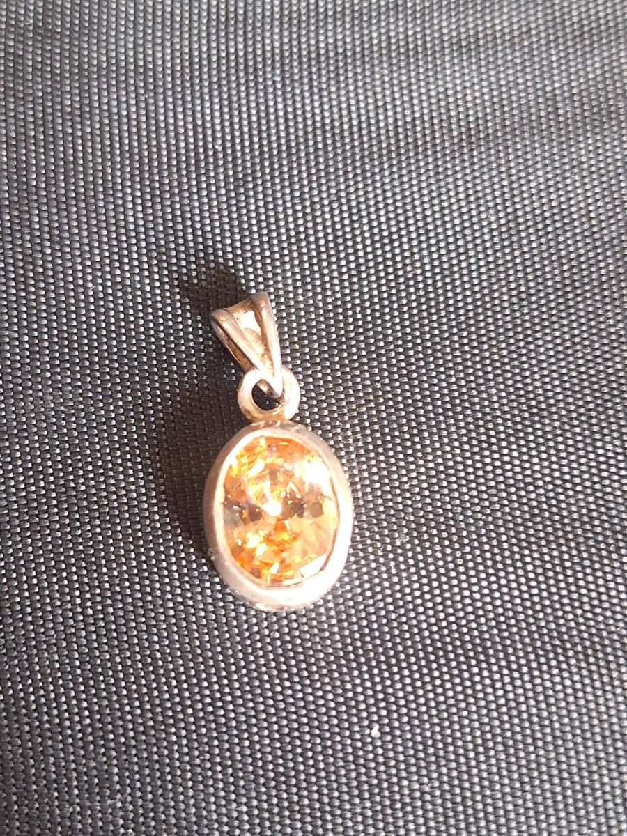 Silver pendant with stone in