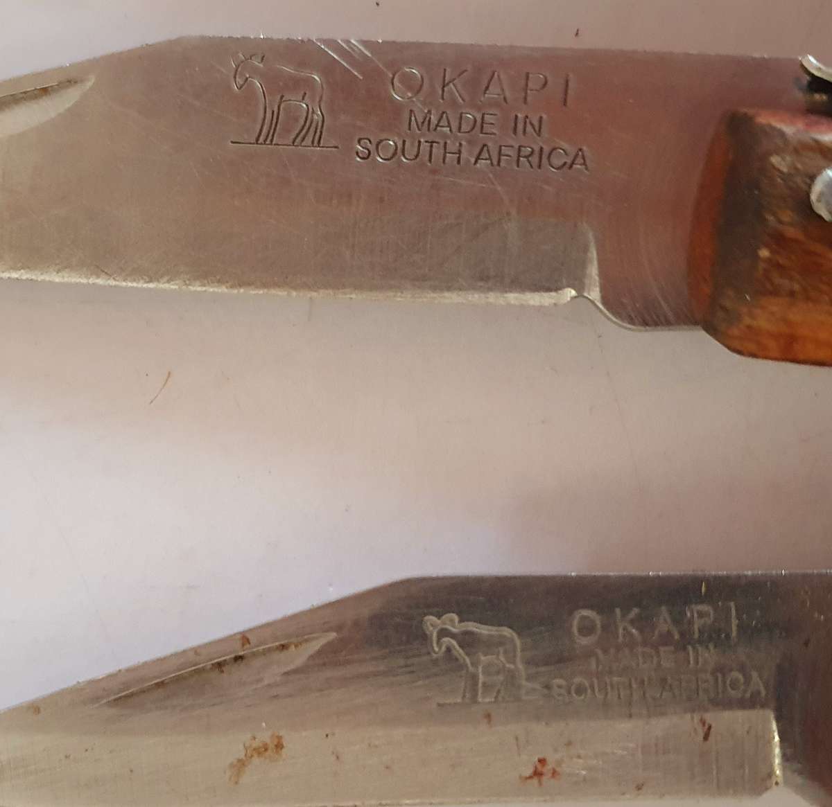7 X VINTAGE OKAPI FOLDING KNIFES. 5 X 23CM, 1X 21CM, 1 X 18CM.